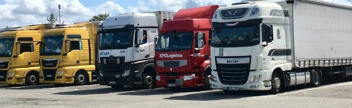 Three lorries parked side by side