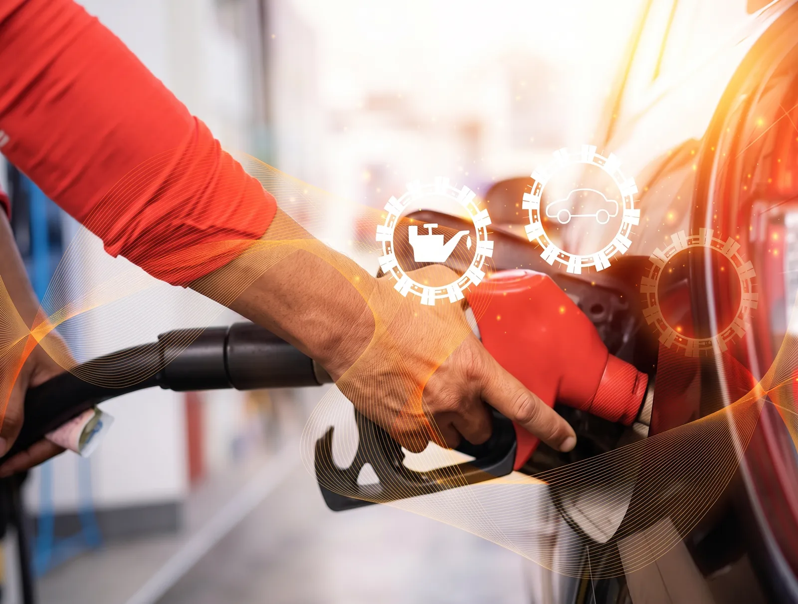Lorry being refuelled at a fuel pump with an AdBlue nozzle beside it, and fuel usage figures on a tablet